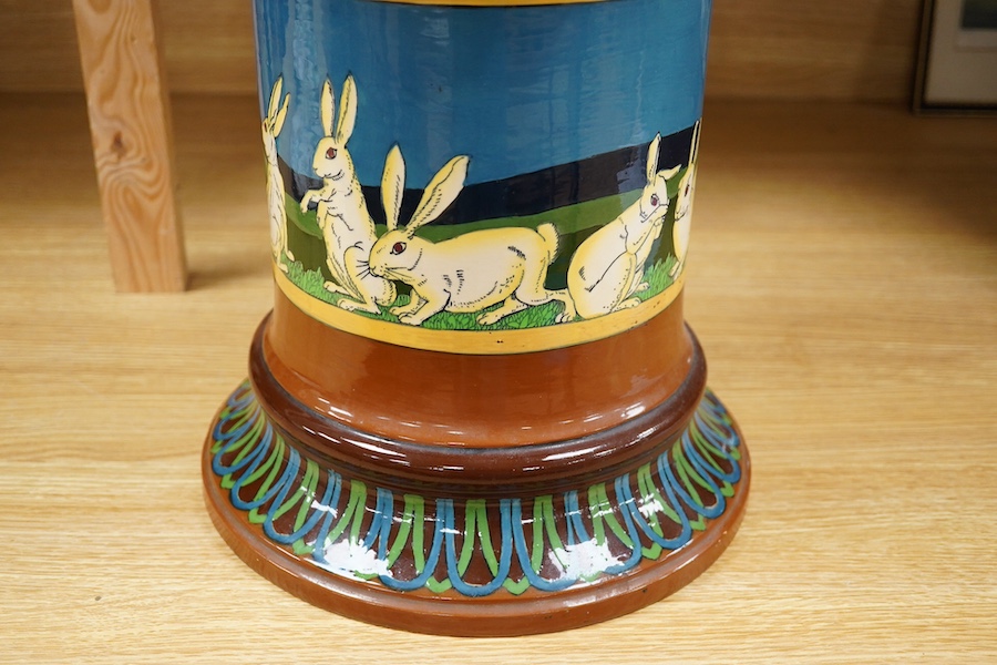 A large Foley Intarsio jardiniere on stand, designed by Frederick Rhead, decorated with rabbits, 60cm high. Condition - restored